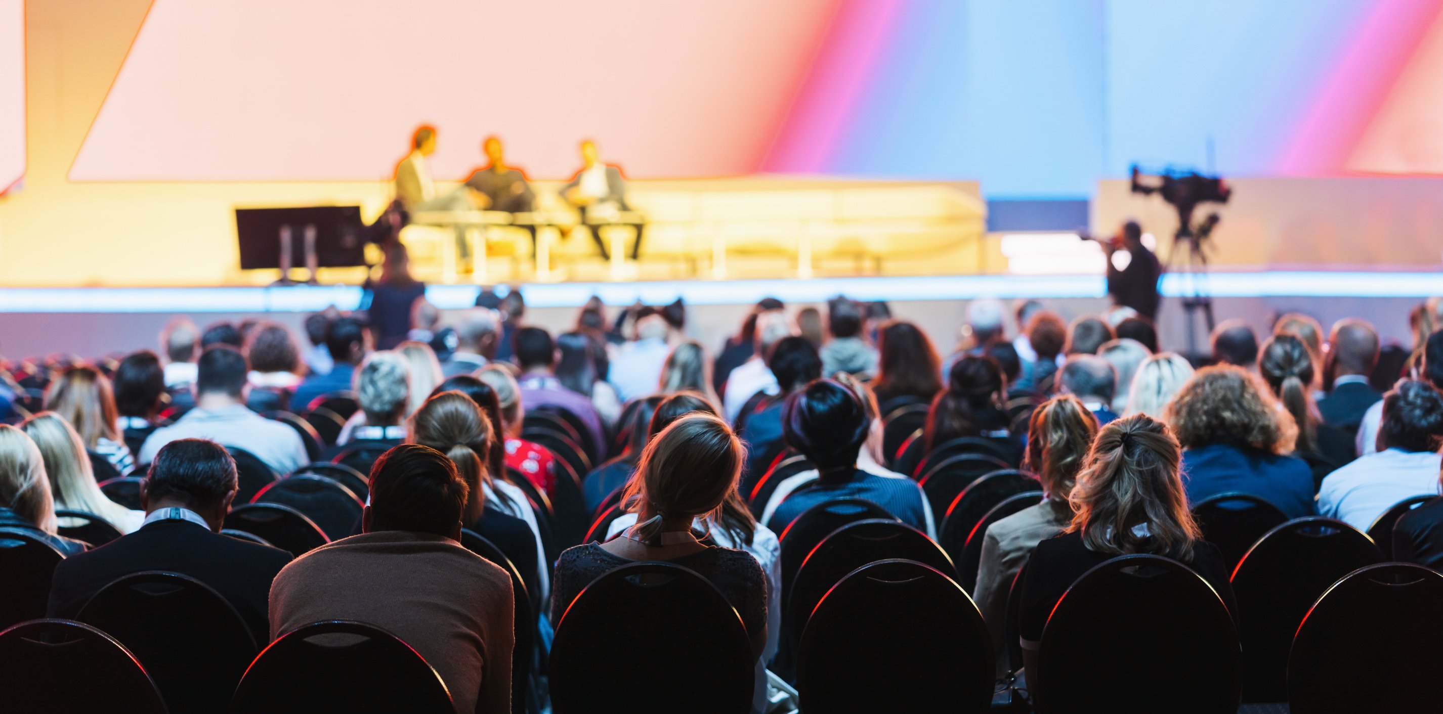 Conference Hall or Seminar Room with Attendee Background